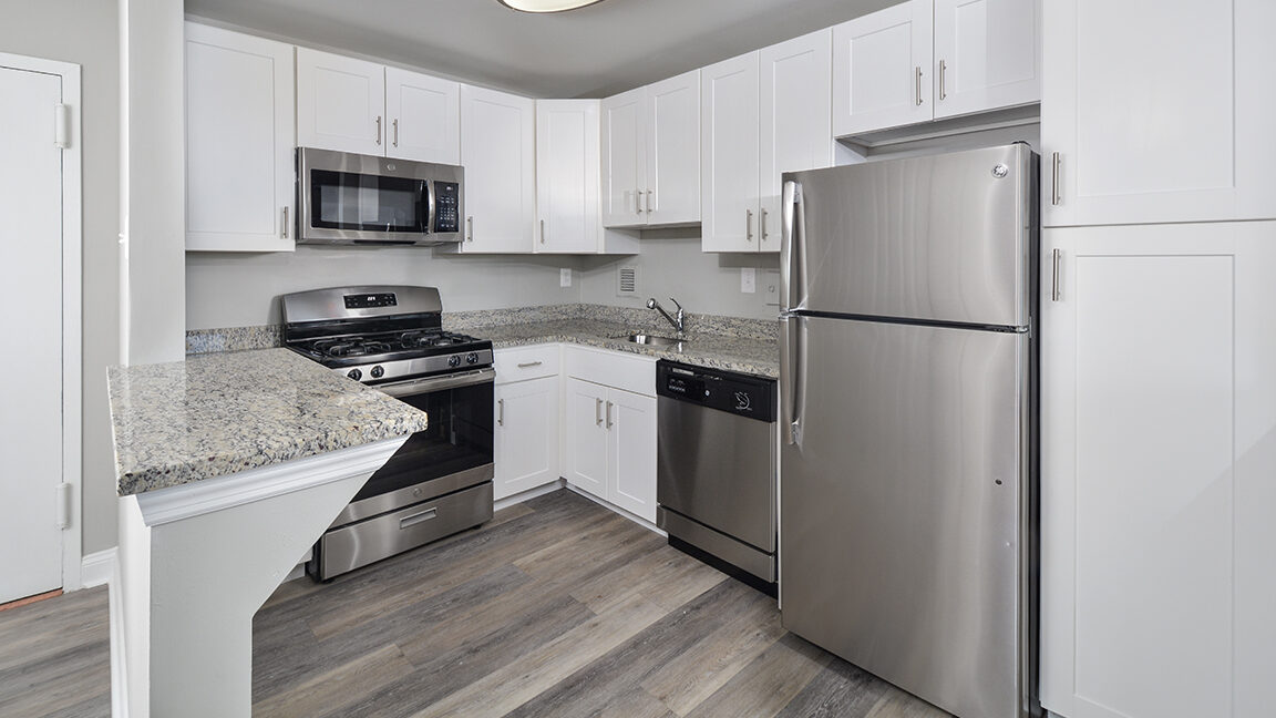 The Helston kitchen with stainless steel appliances and granite countertops