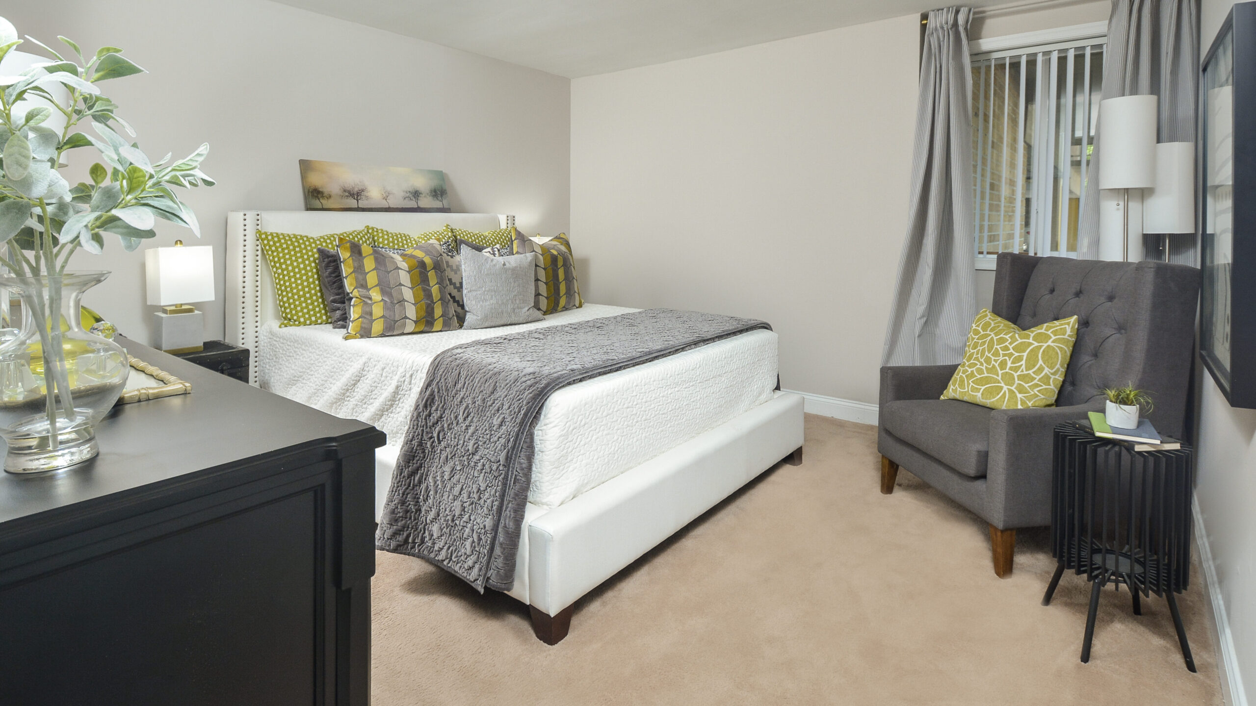 bedroom at The Helston with wall-to-wall carpeting